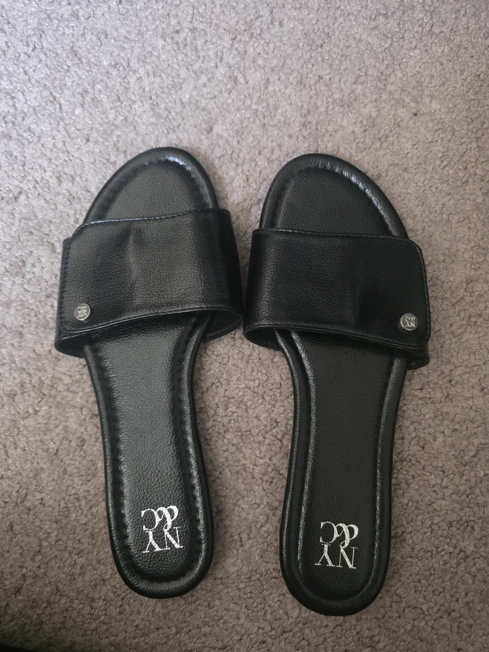 New York & Company Black Slide Sandals with Branded Medallions